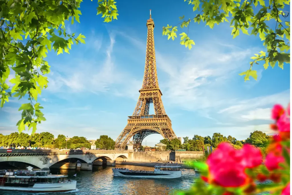 Eiffel Tower with its iron lattice structure and cityscape in the background.